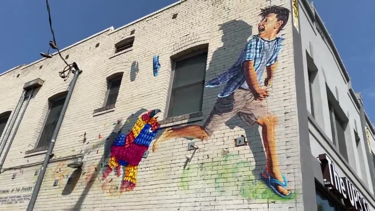 Boy and piñata mural